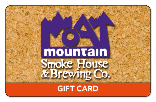 moat mountain logo on a cork board background